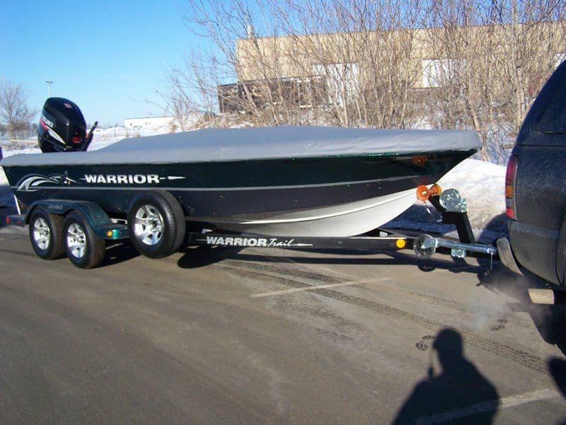 Custom Warrior boat cover protecting boat outdoors by Top Gun Boat Covers